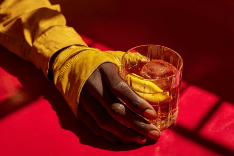 attonconrad_A_close-up_of_an_African_hand_wearing_yellow_glov_a2f42677-2866-44ef-ae49-54ebbec60440_0