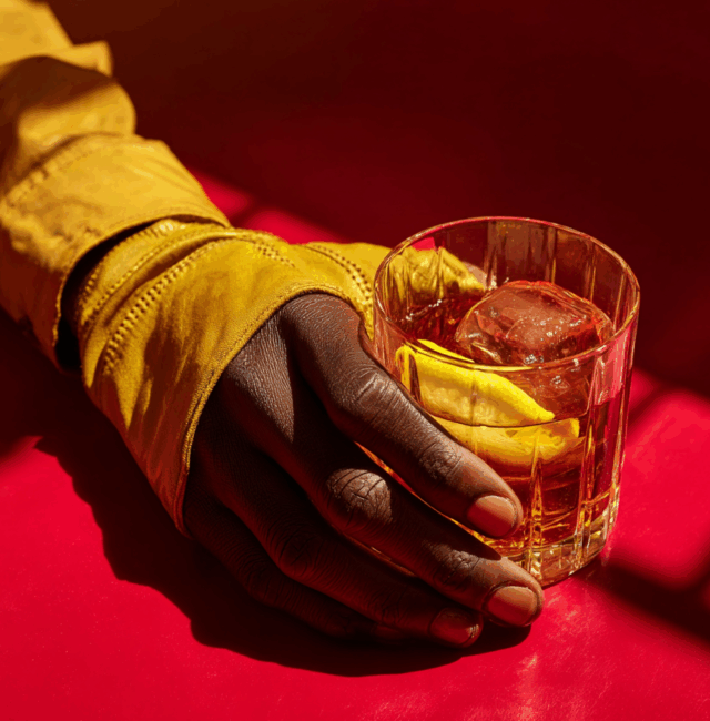 attonconrad_A_close-up_of_an_African_hand_wearing_yellow_glov_a2f42677-2866-44ef-ae49-54ebbec60440_0