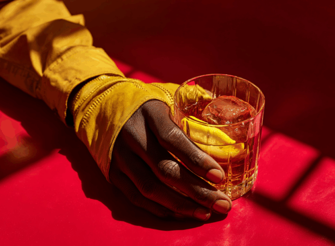 attonconrad_A_close-up_of_an_African_hand_wearing_yellow_glov_a2f42677-2866-44ef-ae49-54ebbec60440_0