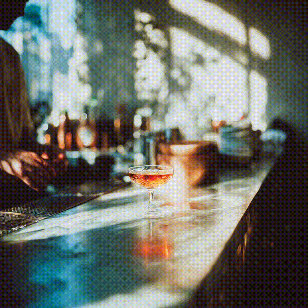 social_attonconrad_A_quiet_moment_in_a_modern_bar_a_bartender_arrang_7123e18b-9f37-4757-937e-e948a3e873d6_1